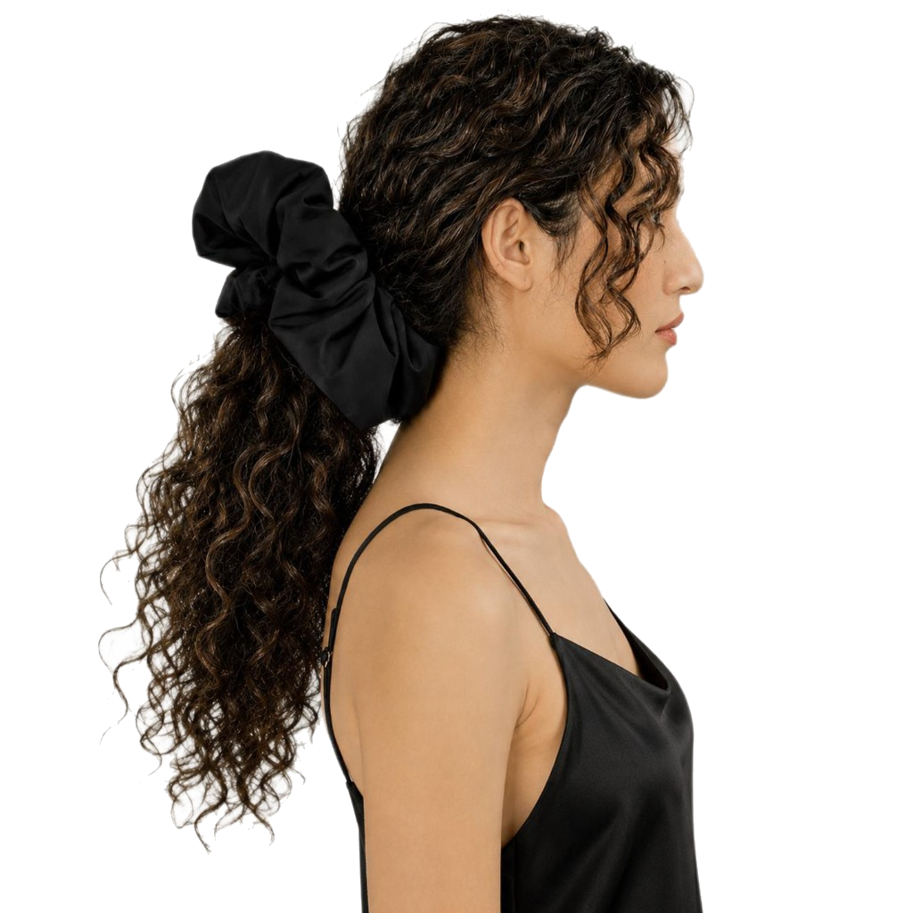 Model wearing The Overnight black silk scrunchie